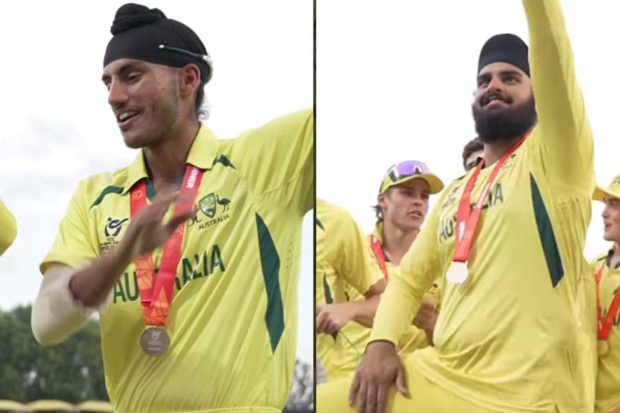 Australia’s Harjas Singh and Harkirat Bajwa celebrate with thigh five । Sangbad Pratidin