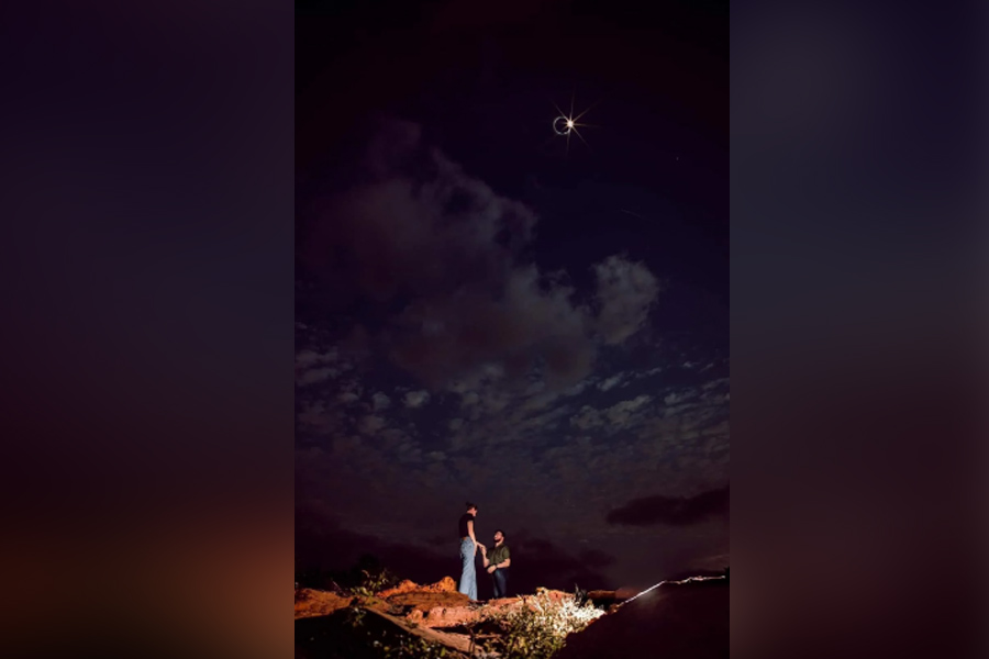 Photo of couple's love offering was captured during total solar eclipse, tells photographer Messi Alexi