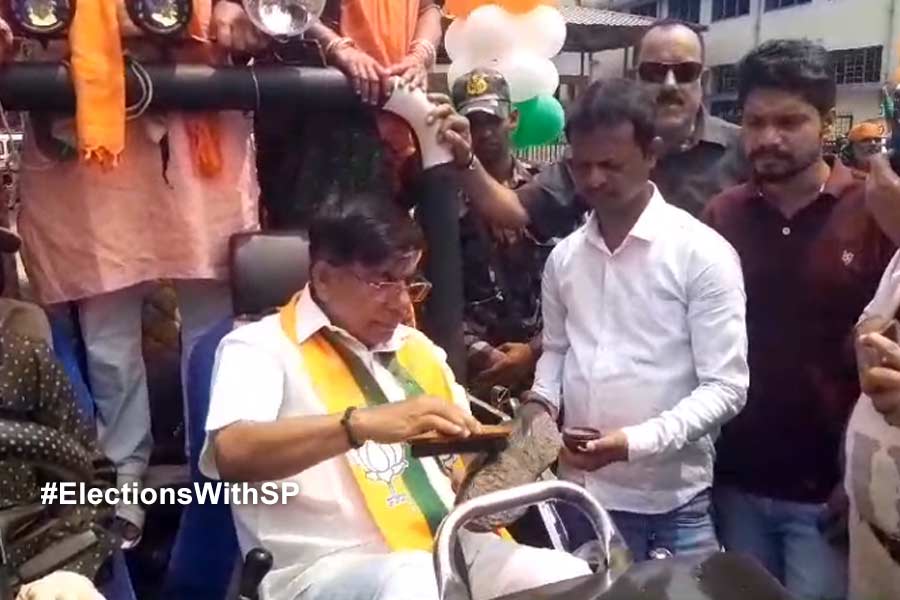 BJP candidate Subhas Sarkar polished his shoes while campaigning for the election