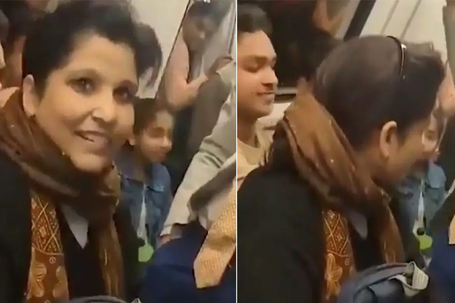 Woman Forcibly Sits on Man's Lap Inside Delhi Metro