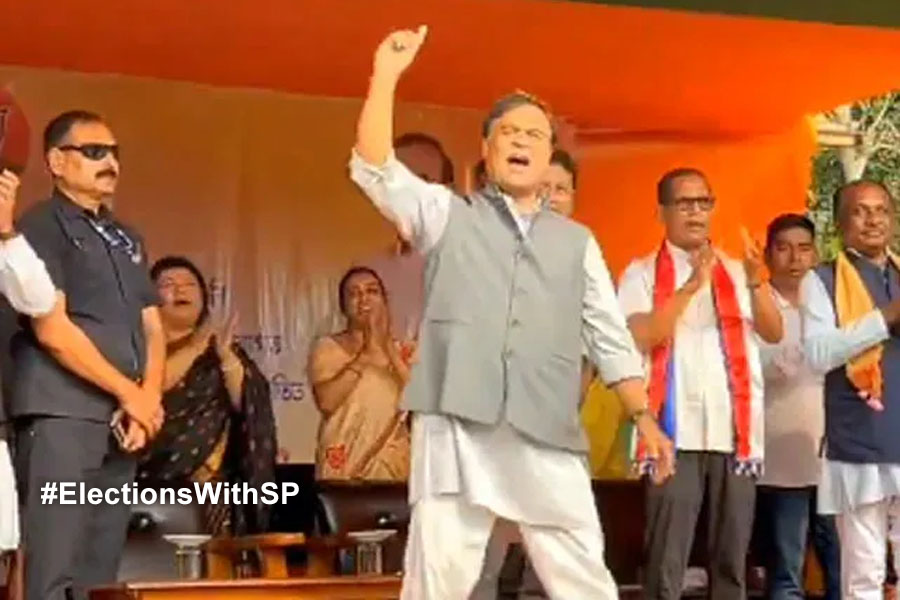 Assam CM Himanta Biswa Sarma dance with supporter during public meeting
