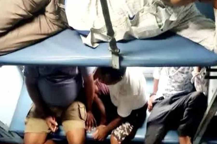 Passengers invading AC coaches seeking relief from scorching heat