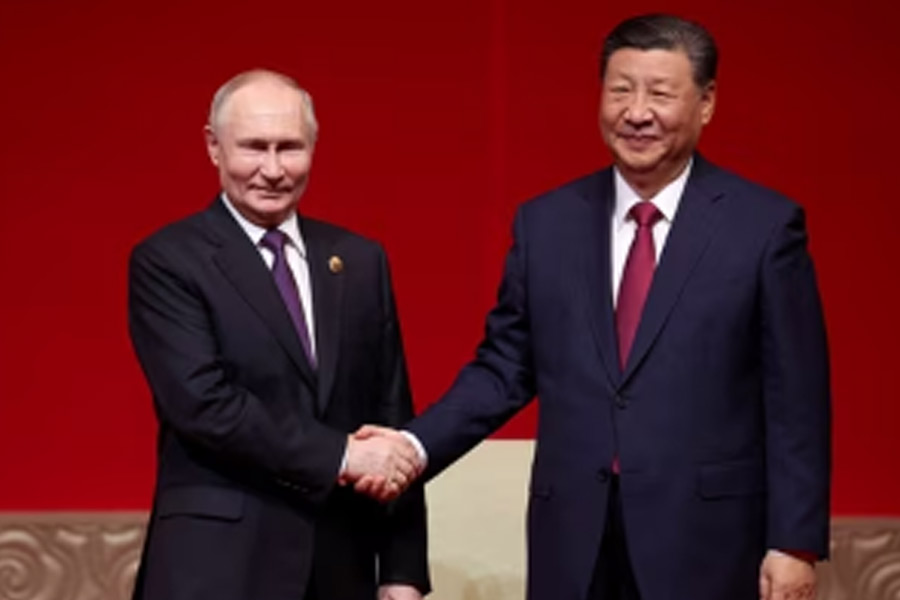 Vladimir Putin meets Xi Jinping in China