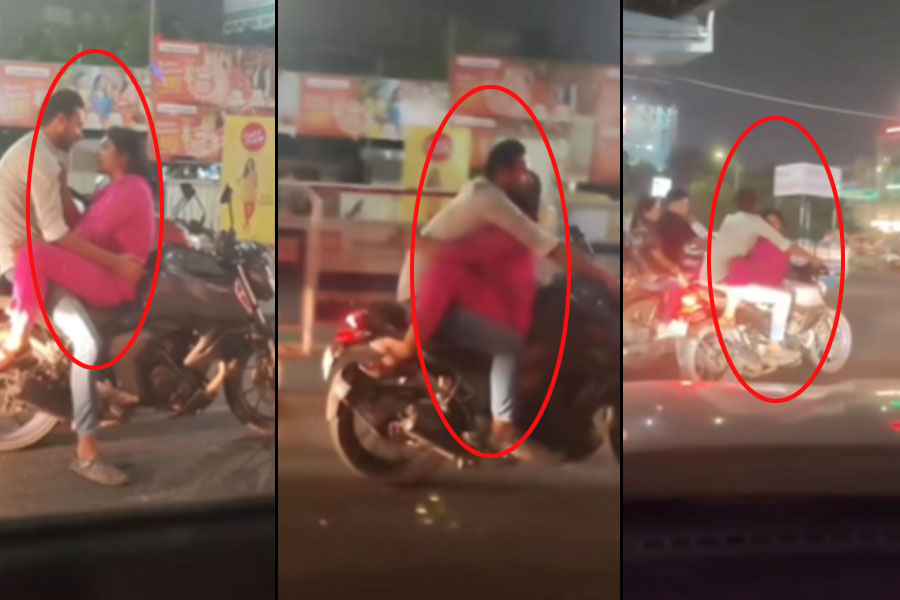 চলন্ত বাইকের ট্যাঙ্কে বসে প্রেমিককে জড়িয়ে গল্প, আদরে মগ্ন প্রেমিকা! ভাইরাল যুগলের ভিডিও