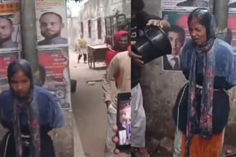 হাড়হিম শীতে ঢাকার রাস্তায় মহিলাকে খুঁটিতে বেঁধে জল ঢেলে নির্যাতন! অট্টহাসি মৌলবাদীদের