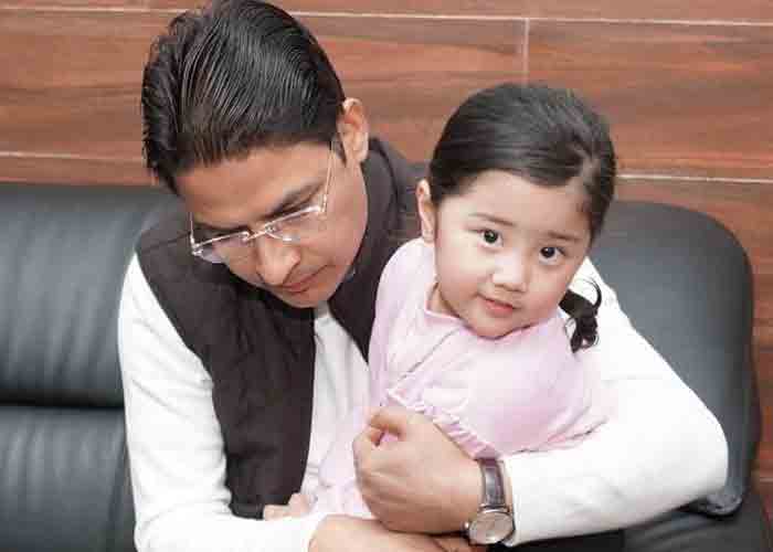 Arya hugs her father Prashant Tamang’s coffin