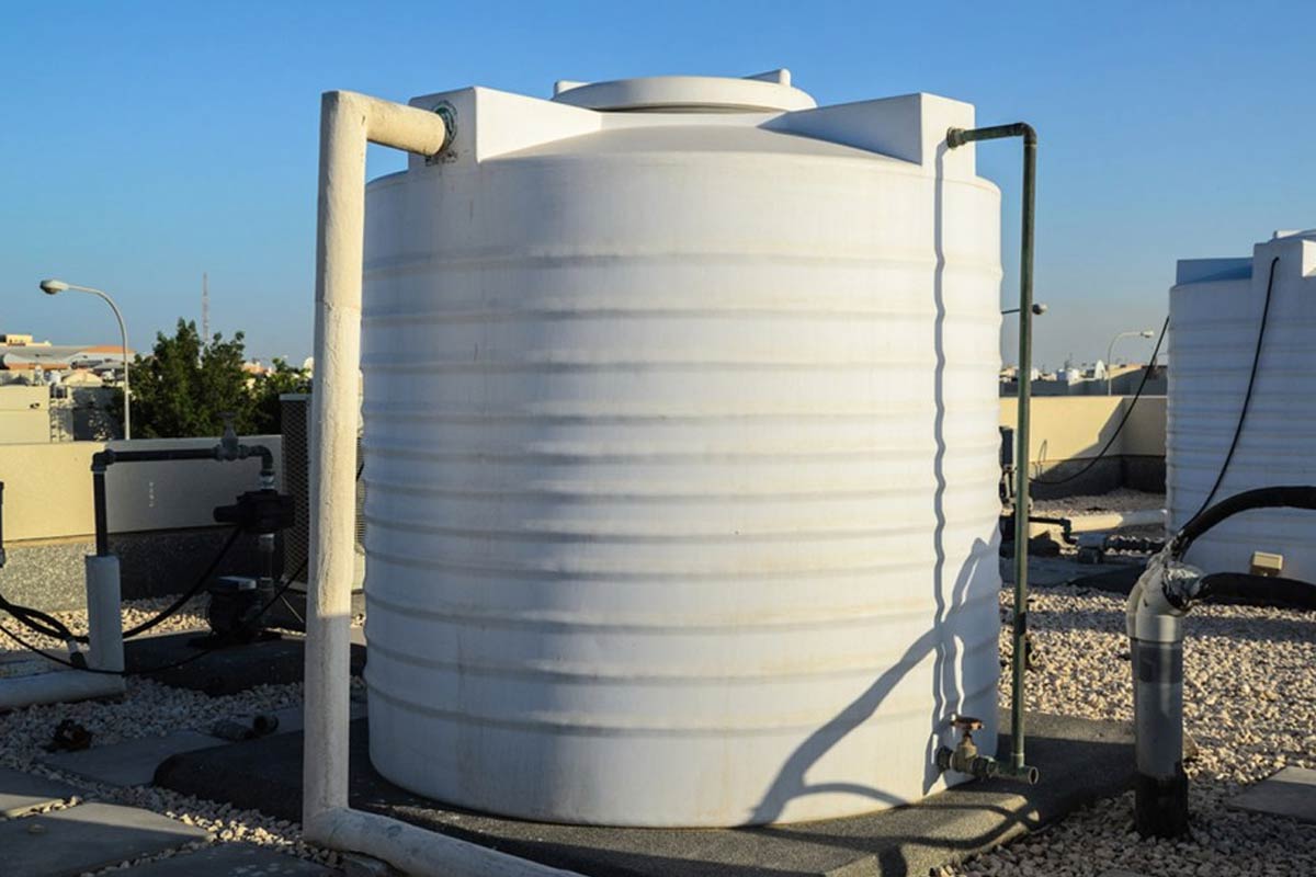 white painted overhead water tank cooling in summer