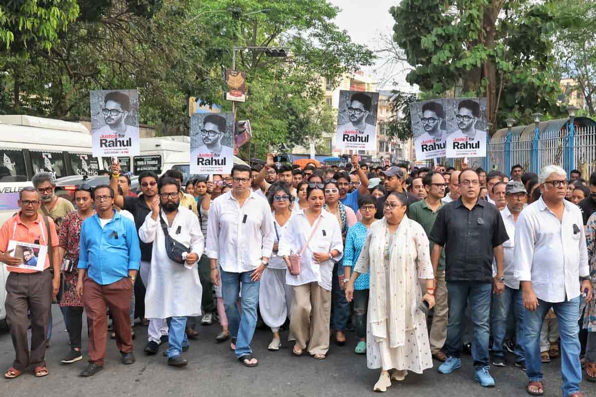 Protest march for Rahul Arunoday Banerjee with “Justice for Rahul” banners and crowd on streets