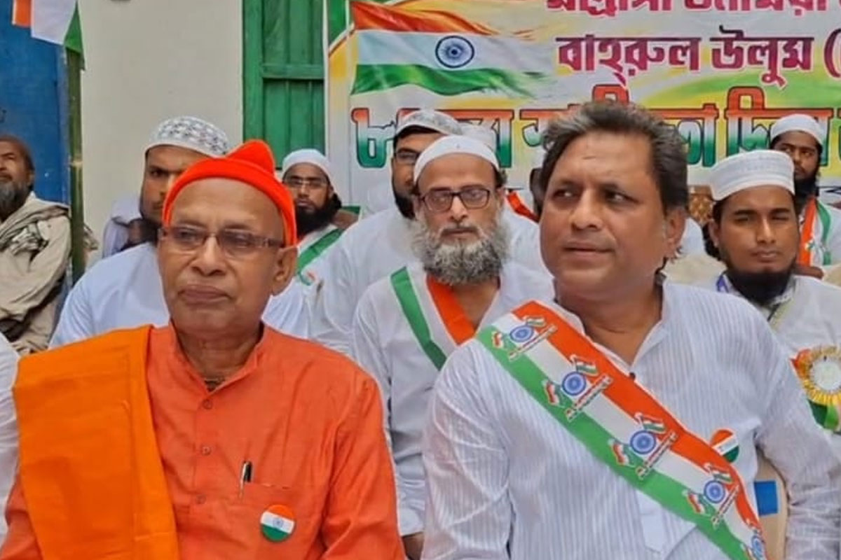 Maharaj from Belur hoists the national flag at a Domkal madrasa on Independence Day